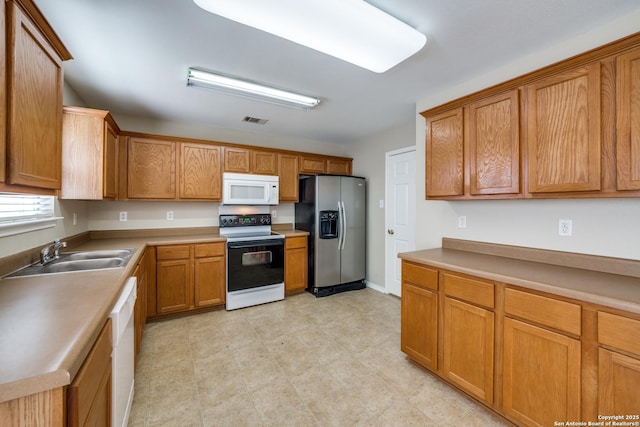 kitchen with white appliances and sink