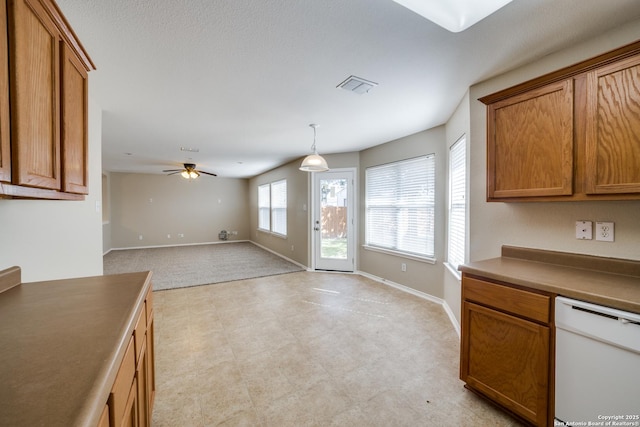 kitchen with ceiling fan, white dishwasher, and decorative light fixtures