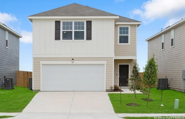 view of property featuring a garage, central AC unit, and a front lawn