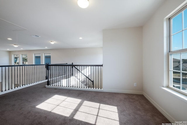 empty room featuring carpet flooring