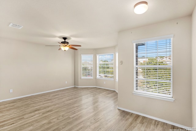 spare room with ceiling fan and light hardwood / wood-style flooring