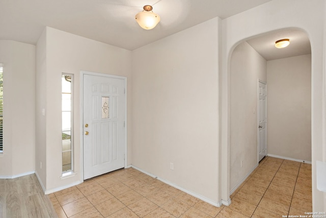 foyer featuring light tile patterned floors