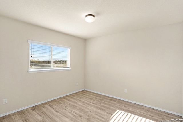 empty room with light hardwood / wood-style floors