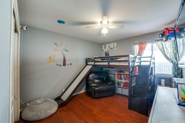 bedroom featuring ceiling fan and hardwood / wood-style floors