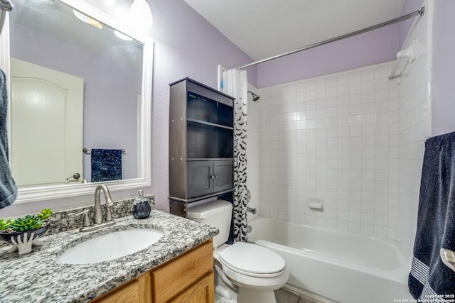 full bathroom with shower / tub combo with curtain, vanity, and toilet