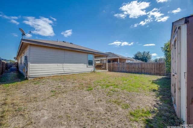 rear view of house featuring a yard