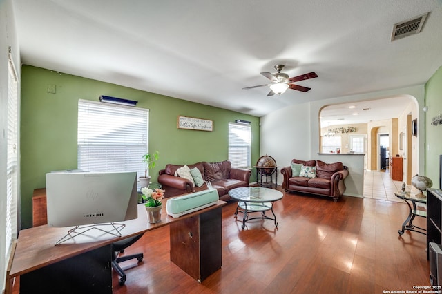 living room featuring hardwood / wood-style flooring, a wealth of natural light, and ceiling fan