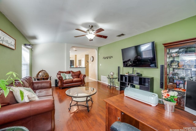 living room with ceiling fan and wood-type flooring