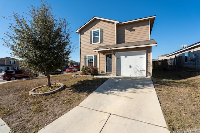 view of front of home featuring a garage and a front yard