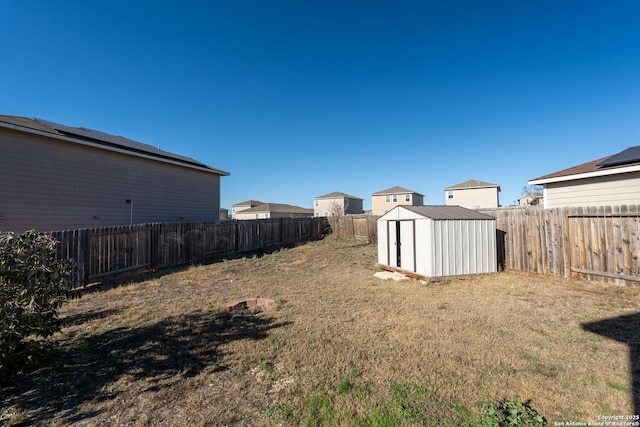 view of yard featuring a storage unit