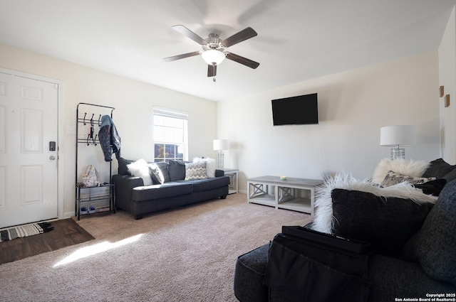 living room featuring carpet and ceiling fan