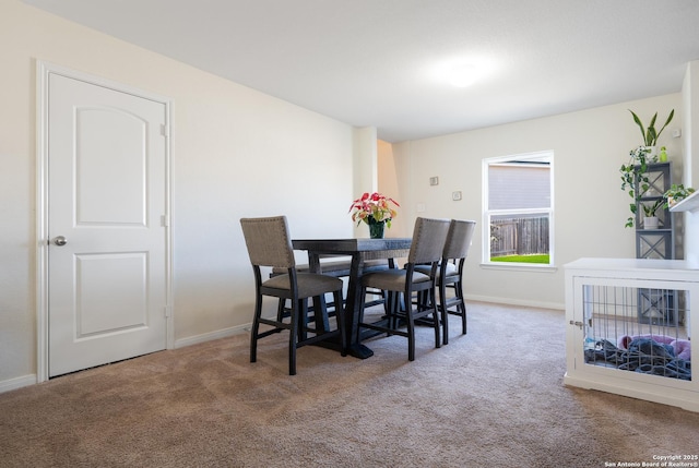 view of carpeted dining area