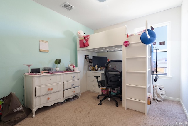 bedroom featuring light carpet