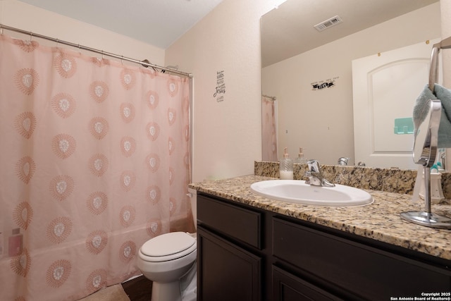 full bathroom with vanity, toilet, and shower / bath combo with shower curtain