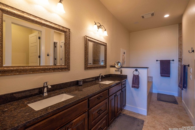 bathroom featuring vanity and tile patterned flooring