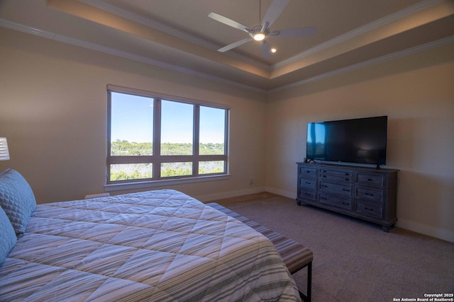 bedroom with light colored carpet, ornamental molding, a raised ceiling, and ceiling fan