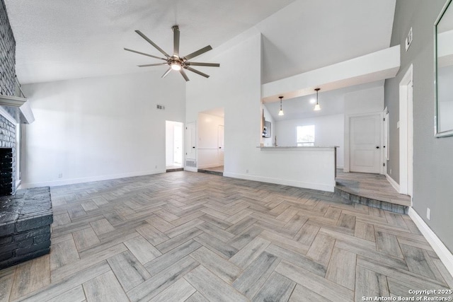 unfurnished living room with high vaulted ceiling, a fireplace, ceiling fan, light parquet flooring, and a textured ceiling