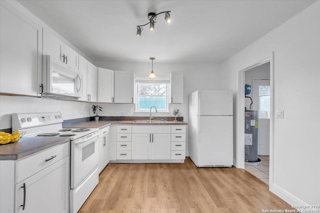 1641 Post Rd, New Braunfels, TX 78130 - kitchen featuring pendant lighting, sink, white appliances, water heater, and white cabinetry