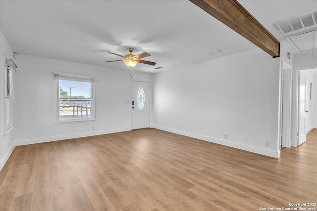1641 Post Rd, New Braunfels, TX 78130 - unfurnished living room with beamed ceiling, ceiling fan, and light hardwood / wood-style flooring