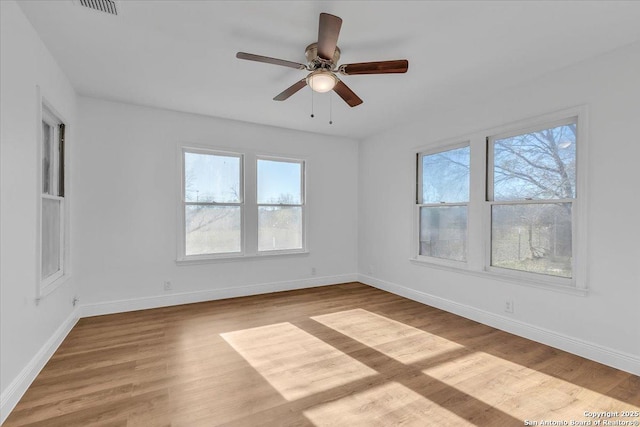 1641 Post Rd, New Braunfels, TX 78130 - unfurnished room with light hardwood / wood-style flooring, plenty of natural light, and ceiling fan