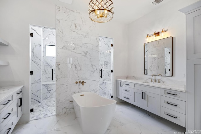 bathroom with vanity and separate shower and tub