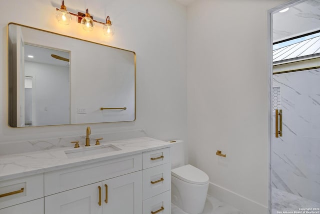 bathroom featuring vanity, toilet, and a shower with shower door