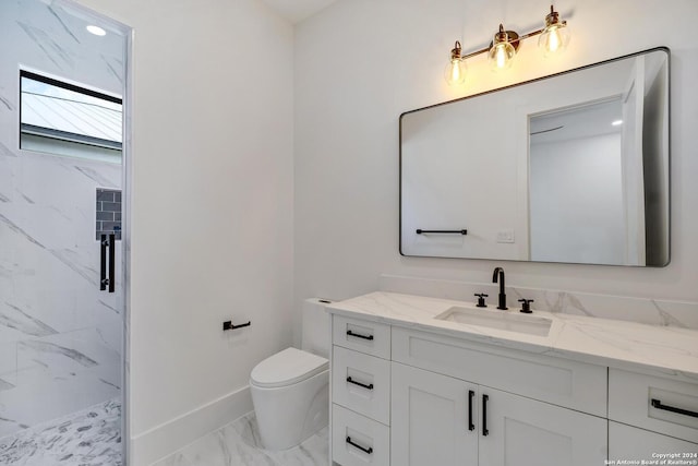 bathroom with vanity, toilet, and walk in shower