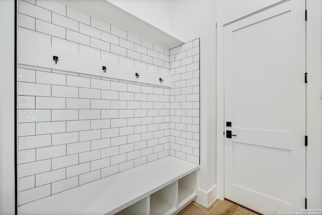 mudroom with light hardwood / wood-style flooring