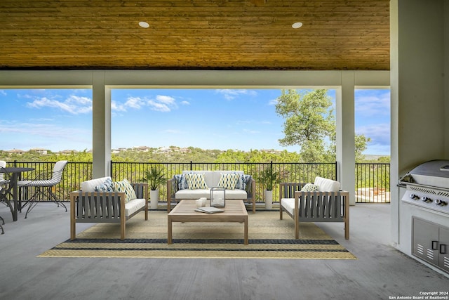 view of patio / terrace with an outdoor living space and exterior kitchen