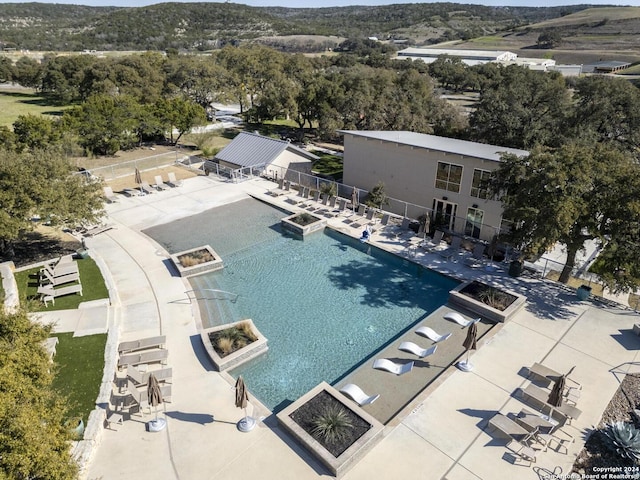 view of swimming pool with a patio