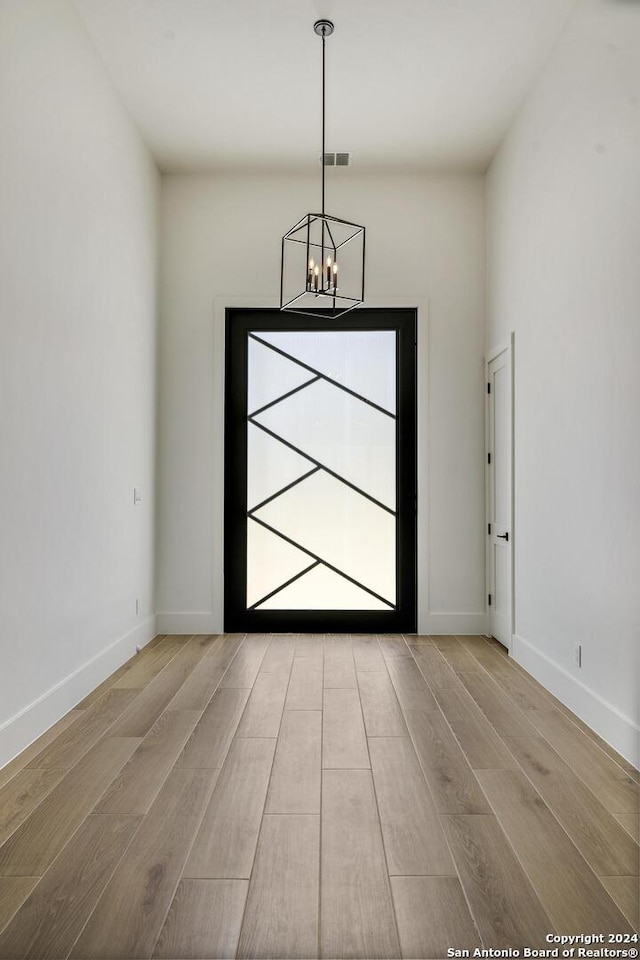 foyer featuring a chandelier