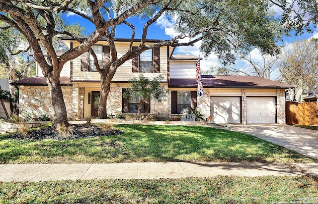 view of front of property with a garage and a front lawn