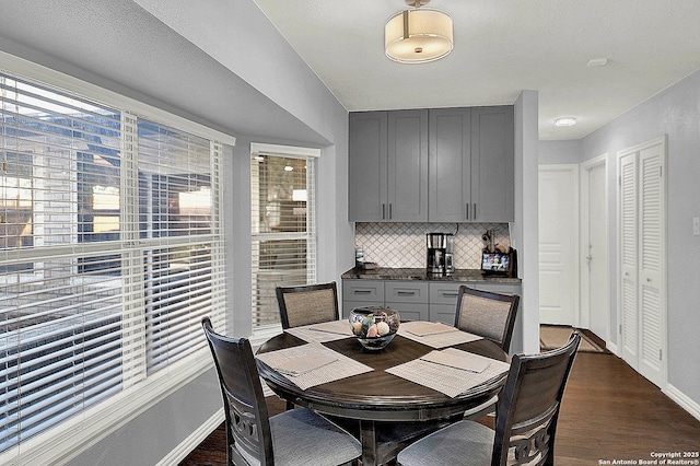 dining space featuring dark hardwood / wood-style floors