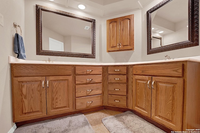 bathroom with tile patterned floors and vanity