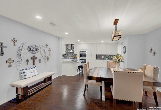 dining space featuring dark hardwood / wood-style floors