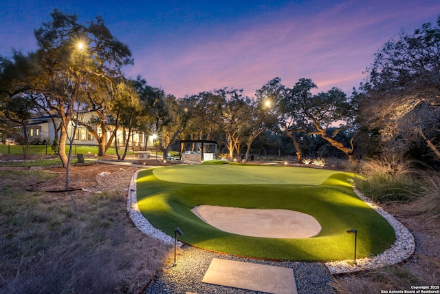 view of property's community featuring a gazebo and golf course view