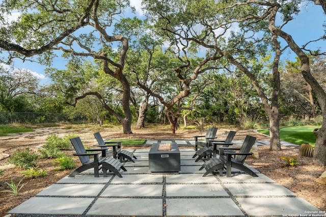 view of patio / terrace with an outdoor fire pit