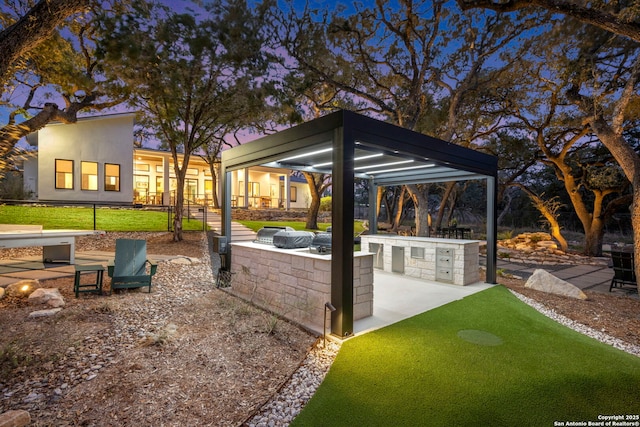 view of patio / terrace featuring an outdoor fire pit