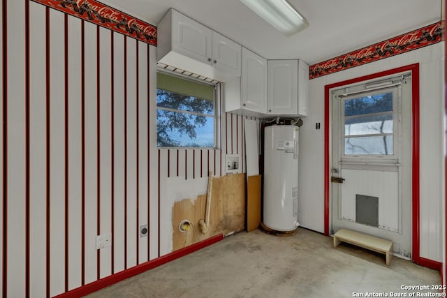 laundry room featuring water heater