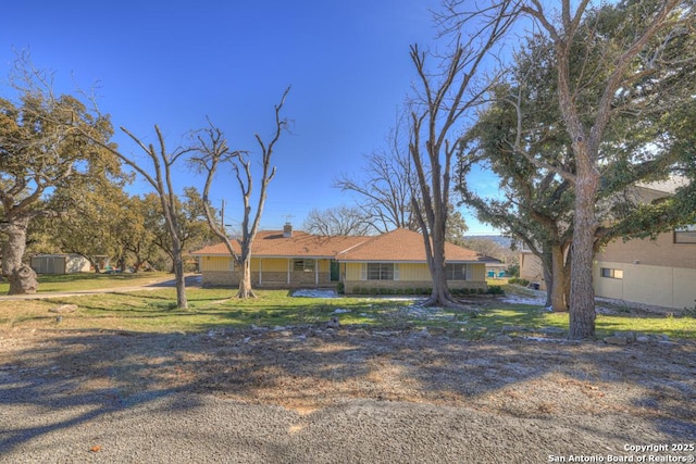 ranch-style house with a front lawn