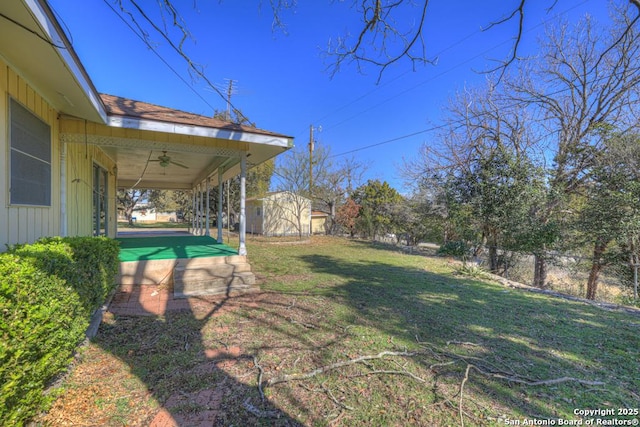 view of yard featuring ceiling fan