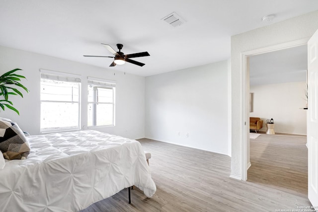 bedroom featuring ceiling fan and light wood-type flooring