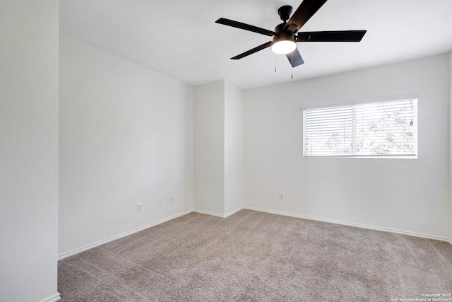 unfurnished room featuring light colored carpet and ceiling fan