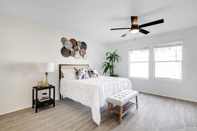 bedroom featuring ceiling fan and light hardwood / wood-style flooring