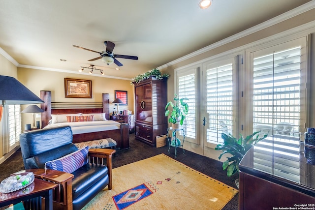 bedroom featuring crown molding, dark colored carpet, multiple windows, and access to outside