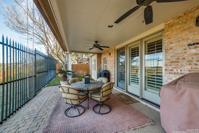 view of patio / terrace featuring area for grilling and ceiling fan