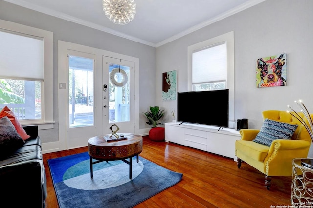 living room featuring hardwood / wood-style flooring and ornamental molding