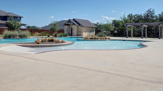 community pool featuring a pergola, fence, and a patio area