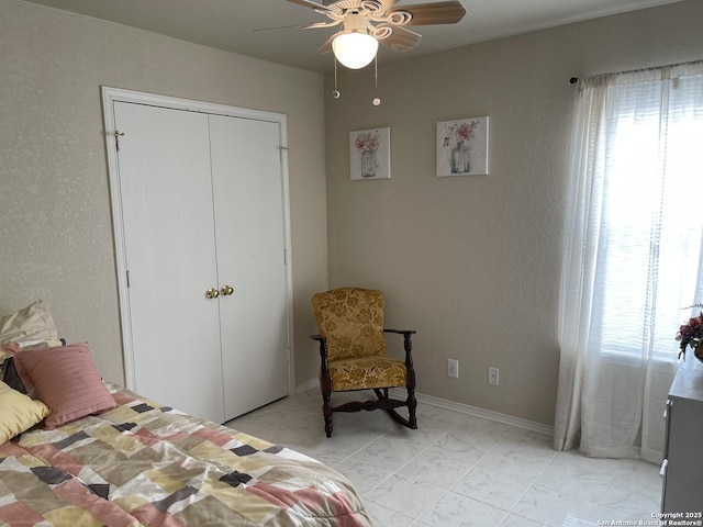 bedroom featuring a closet and ceiling fan