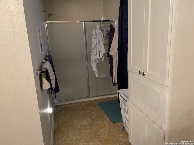 bathroom featuring an enclosed shower